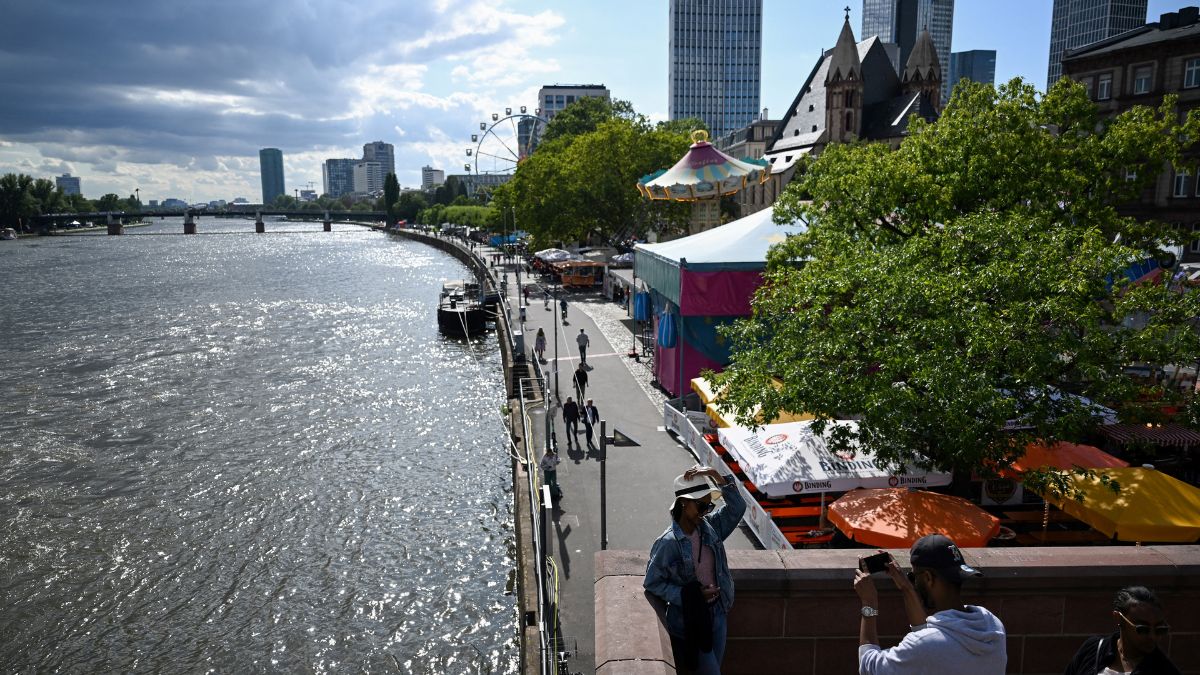 A woman poses for a picture on a bridge above the Main river in the centre of Frankfurt am Main, western Germany, on August 7, 2023. File Photo/AFP A woman poses for a picture on a bridge above the Main river in the centre of Frankfurt am Main, western Germany, on August 7, 2023. File Photo/AFP