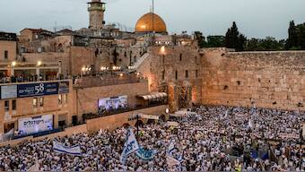 People gather at Western Wall Plaza in the old city of Jerusalem on May 26, 2025 marking Jerusalem Day, commemorating the Israeli army's 1967 capture of the city's eastern sector during the Arab-Israeli war. AFP