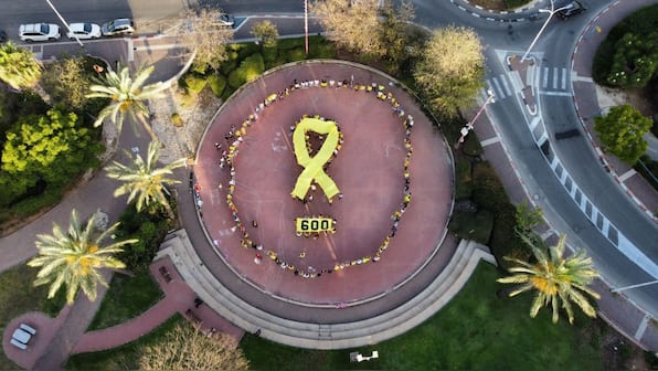 600 days of Gaza war: ‘Save them now,’ Israelis form yellow hostage symbols across the country