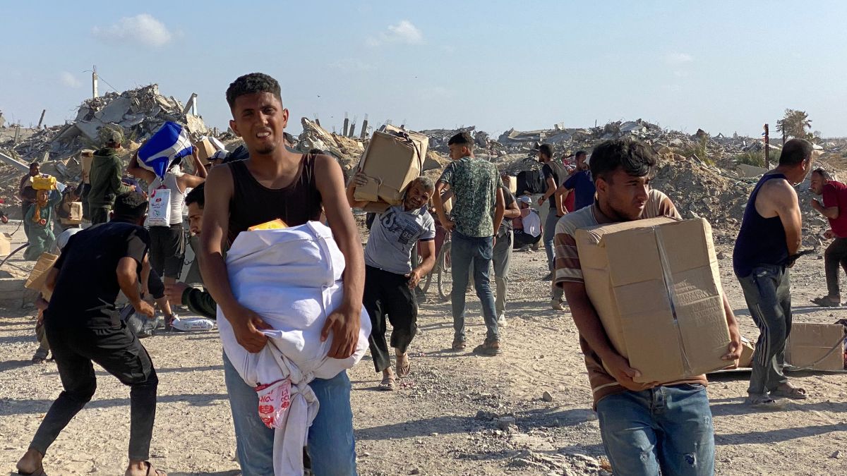 Men look around on alert in the wake of gunfire shots as displaced Palestinians receive food packages from a US-backed foundation pledging to distribute humanitarian aid in western Rafah in the southern Gaza Strip on May 27, 2025. AFP Men look around on alert in the wake of gunfire shots as displaced Palestinians receive food packages from a US-backed foundation pledging to distribute humanitarian aid in western Rafah in the southern Gaza Strip on May 27, 2025. AFP