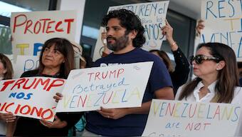 People stand together to support a resolution in favour of reinstating temporary protected status for Venezuelans on February 13, 2025 in Miami, Florida. AFP File 