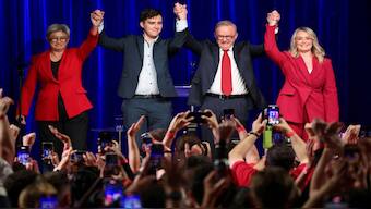 Australia's Prime Minister Anthony Albanese celebrates with his partner Jodie Haydon, his son Nathan Albanese and Minister for Foreign Affairs Penny Wong at a Labor party election night event, after local media projected the Labor Party's victory, on the day of the Australian federal election, in Sydney, Australia. Reuters