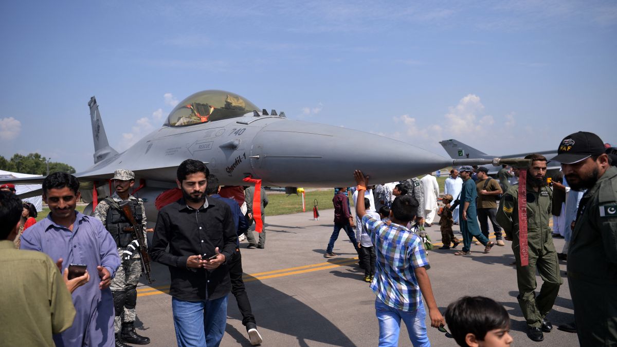 Pakistanis look at a F-16 jet fighter at the Nur Khan military airbase in Islamabad. File image/AFP Pakistanis look at a F-16 jet fighter at the Nur Khan military airbase in Islamabad. File image/AFP