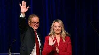 Australia's Prime Minister Anthony Albanese waves beside his partner Jodie Haydon after winning the general election at the Labor Party election night event in Sydney on May 3, 2025. Source: AFP