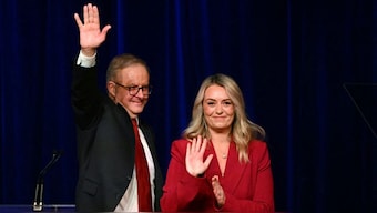 Australia's Prime Minister Anthony Albanese waves beside his partner Jodie Haydon after winning the general election at the Labor Party election night event in Sydney on May 3, 2025. Source: AFP