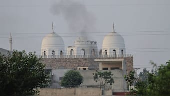 Local residents stand outside a mosque of an Islamic seminary partially damaged by a suspected Indian missile attack, outskirts of Bahawalpur, Pakistan (AP)