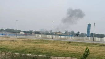 A plume of black smoke emerges after three blasts were reported in Lahore near a military airport. Source: X