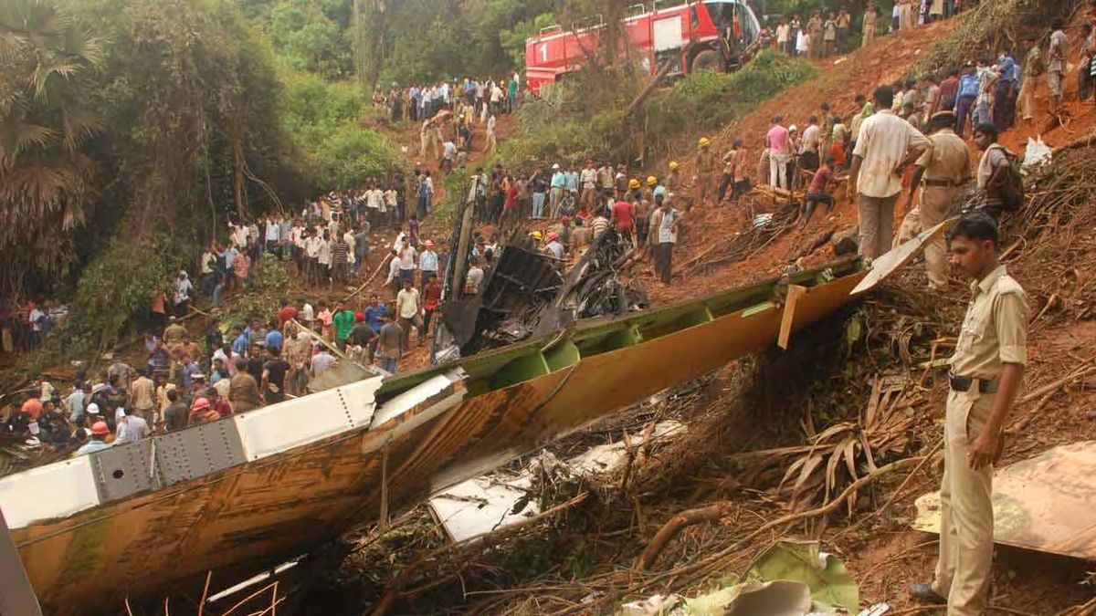 Locals and police crowd at the crash site of Mangaluru Air India Express on May 22, 2010. File image/PTI Locals and police crowd at the crash site of Mangaluru Air India Express on May 22, 2010. File image/PTI