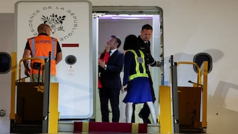 France's President Emmanuel Macron being pushed in the face reportedly by his wife Brigitte Macron as the couple arrived in Vietnam to begin a tour of Southeast Asia, at Noi Bai International Airport, in Hanoi. Reuters