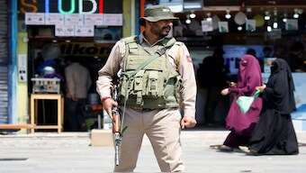 An Indian security force personnel stands guard on a street, following the terror attack in south Kashmir's Pahalgam, in Srinagar. Reuters