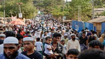Rohingya refugees gather at roadside kitchen market, at the refugee camp in Cox's Bazar, Bangladesh, March 15, 2025. Image: REUTERS/Mohammad Ponir Hossain 