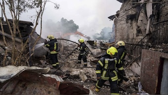 Rescue workers extinguish a fire of a house destroyed by a Russian strike in Markhalivka village, Kyiv region, Ukraine. AP file/Representative image