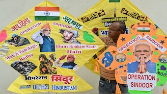 A kitemaker displays kites featuring Indian Prime Minister Narendra Modi and 'Operation Sindoor', India's military operation against Pakistan, in Amritsar. AFP