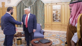 Interim Syrian President Ahmad al-Sharaa shakes hands with US President Donald Trump in Riyadh, Saudi Arabia in the presence of Saudi Crown Prince Mohammed bin Salman. AP