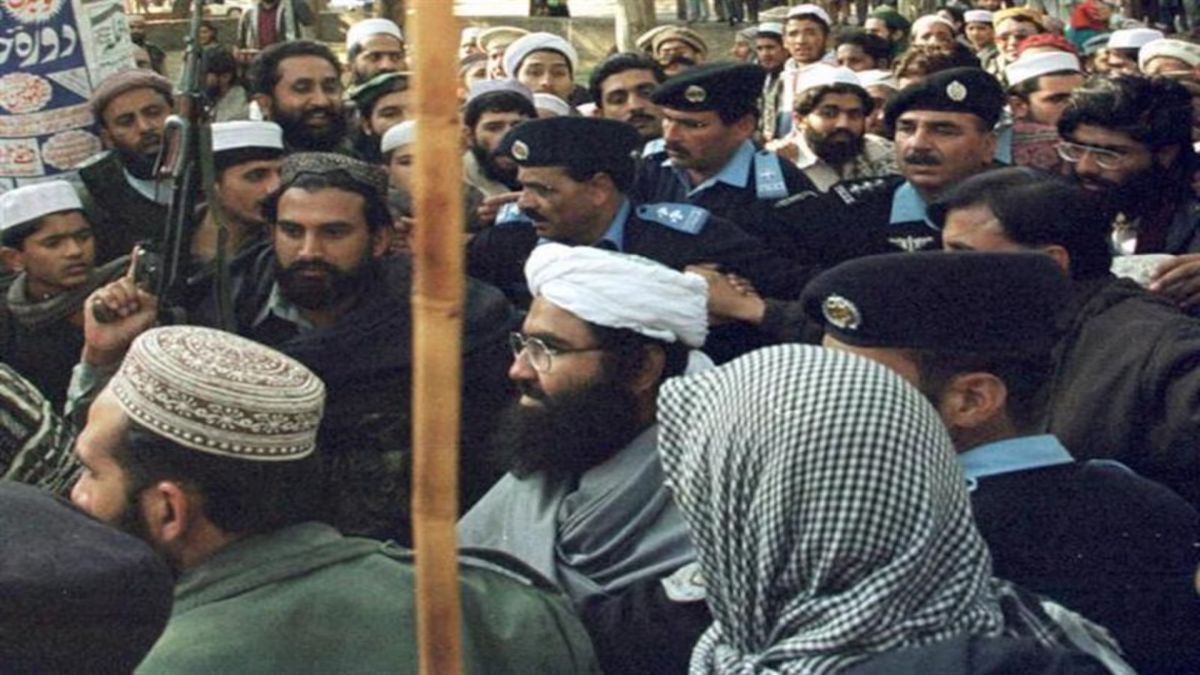 Jaish-e-Mohammed's Masood Azhar surrounded by armed guards and Pakistan police. File image/Reuters Jaish-e-Mohammed's Masood Azhar surrounded by armed guards and Pakistan police. File image/Reuters