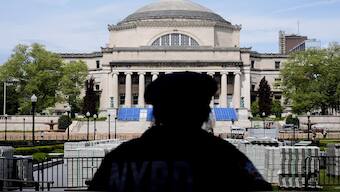 A New York City police officer looks over the centre of Columbia University in New York. File image/AP