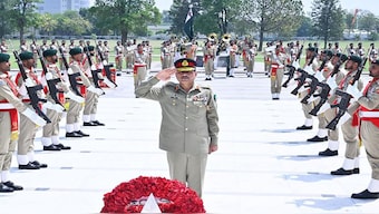 Pakistan's Field Marshal Syed Asim Munir salutes after laying wreath on the martyrs' monument during a guard of honour ceremony at General Headquarters (GHQ) in Rawalpindi. AFP