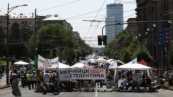 University students and other people commemorate the 16 victims, who were killed after a railway concrete canopy fell in November 2024 in Novi Sad, during a protest against government pressure on the universities, in front of a government building, in Belgrade, Serbia. Reuters