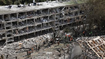 Emergency personnel work at an impact site following a missile attack from Iran on Israel, amid the Iran-Israel conflict, in Tel Aviv, Israel. Reuters