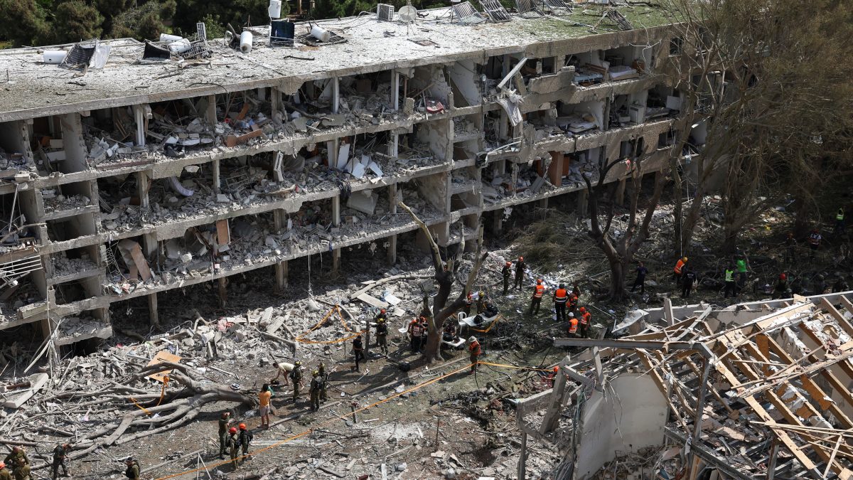 Emergency personnel work at an impact site following a missile attack from Iran on Israel, amid the Iran-Israel conflict, in Tel Aviv, Israel. Reuters Emergency personnel work at an impact site following a missile attack from Iran on Israel, amid the Iran-Israel conflict, in Tel Aviv, Israel. Reuters