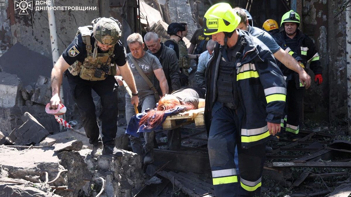 Rescuers carry an injured woman at the site of a building damaged by a Russian missile strike. Reuters Rescuers carry an injured woman at the site of a building damaged by a Russian missile strike. Reuters