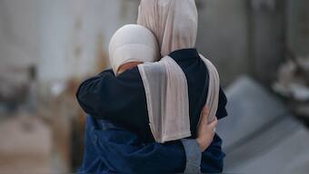 Women embrace, while mourning loved ones, during the funeral of Palestinians killed by Israeli fire yesterday, as they sought aid in northern Gaza, according to Gaza's health ministry, at Al-Shifa Hospital, in Gaza City. Reuters
