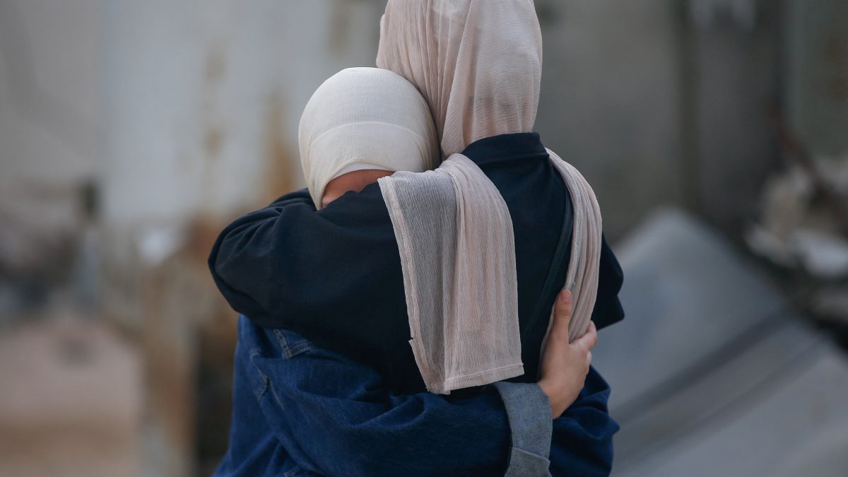 Women embrace, while mourning loved ones, during the funeral of Palestinians killed by Israeli fire yesterday, as they sought aid in northern Gaza, according to Gaza's health ministry, at Al-Shifa Hospital, in Gaza City. Reuters Women embrace, while mourning loved ones, during the funeral of Palestinians killed by Israeli fire yesterday, as they sought aid in northern Gaza, according to Gaza's health ministry, at Al-Shifa Hospital, in Gaza City. Reuters