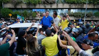 Brazil's former President Jair Bolsonaro (C) leaves a rally on Paulista Avenue in Sao Paulo, Brazil, on June 29, 2025. AFP