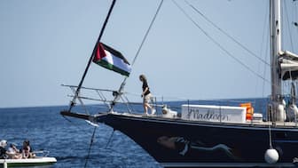 Climate activist Greta Thunberg boards the Madleen boat before setting sail for Gaza along with activists of the Freedom Flotilla Coalition, departing from the Sicilian port of Catania, Italy. AP