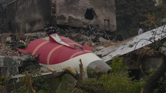 Parts of an Air India plane that crashed on Thursday are seen on top of a building in Ahmedabad, India. AP