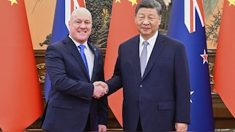 In this photo released by Xinhua News Agency, visiting New Zealand's Prime Minister Christopher Luxon, left shakes hands with Chinese President Xi Jinping prior to their bilateral meeting in Beijing, Friday, June 20, 2025. (Shen Hong/Xinhua via AP)