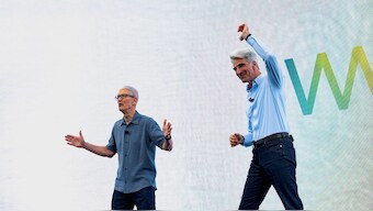 Apple CEO Tim Cook and Senior Vice President of Software Engineering Craig Federighi speak during Apple's annual World Wide Developers Conference at the company's headquarters in Cupertino, California, US, June 9, 2025. Reuters