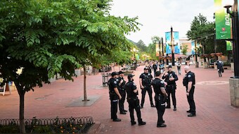 Police officers gather on Pearl Street in front of the Boulder County Courthouse, the scene of an attack that injured multiple people, in Boulder, Colorado, US, June 2, 2025. File Image/Reuters