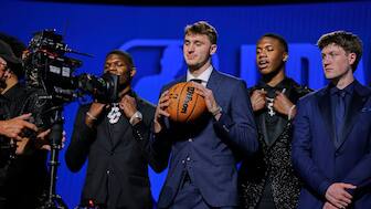 Cooper Flagg, center, poses for the camera before the start of the first round of the NBA basketball draft. Image: AP 
