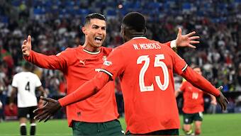 Cristiano Ronaldo celebrates with Nuno Mendes after scoring Portugal's second goal in their UEFA Nations League semi-final against Germany in Munich. Reuters