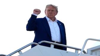 President Donald Trump boards Air Force One at Joint Base Andrews, Md. on Tuesday. AP