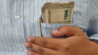 Caught in an ever-mounting debt Indian middle class is struggling to pay EMIs leave alone savings. Shutterstock