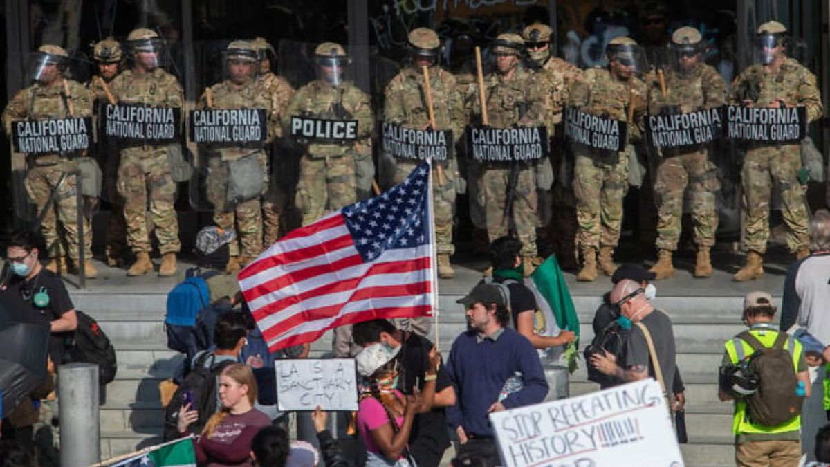 Demonstrators holding signs and flags face California National Guard members standing guard outside the Federal Building as they protest federal immigration operations in Los Angeles, on June 9, 2025. (Photo: AFP) Demonstrators holding signs and flags face California National Guard members standing guard outside the Federal Building as they protest federal immigration operations in Los Angeles, on June 9, 2025. (Photo: AFP)