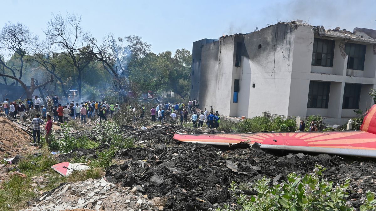 People near the debris of the Air India plane that crashed moments after taking off from the airport, in Ahmedabad, Gujarat, India, Thursday, June 12, 2025. The London-bound plane was carrying 242 passengers. (Photo: PTI Photo) People near the debris of the Air India plane that crashed moments after taking off from the airport, in Ahmedabad, Gujarat, India, Thursday, June 12, 2025. The London-bound plane was carrying 242 passengers. (Photo: PTI Photo)