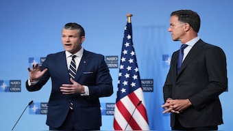 Defence Secretary Pete Hegseth, left, and Nato Secretary General Mark Rutte deliver statements ahead of a meeting of Nato defence ministers at Nato headquarters in Brussels, on Thursday. AP