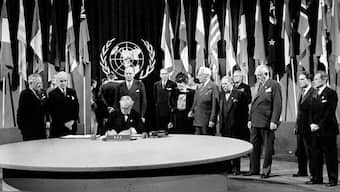 President Harry S. Truman and the entire American delegation look on as Sen. Tom Connally signs the United Nations Charter in San Francisco, June 26, 1945. File image/AP