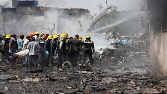 Firefighters work to put out a fire at the site where an Air India Boeing 787 Dreamliner plane crashed in Ahmedabad, India, on Friday. Reuters