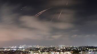 Missiles launched from Iran are intercepted, as seen from the city of Ashkelon, Israel, June 13, 2025. Reuters