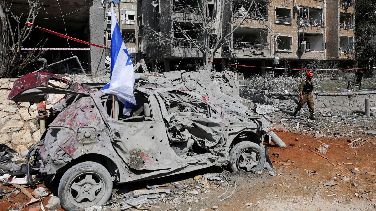 A rescue personnel walks next to a damaged vehicle at an impact site following missile attack from Iran on Israel, in Ramat Gan, Israel, June 14, 2025. File Image/Reuters A rescue personnel walks next to a damaged vehicle at an impact site following missile attack from Iran on Israel, in Ramat Gan, Israel, June 14, 2025. File Image/Reuters