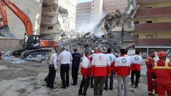 Rescuers work at the site of a damaged building, in the aftermath of Israeli strikes, in Tehran, Iran, June 13, 2025. Reuters