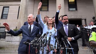 Karen Read, centre, waves to supporters after she was found not guilty of second-degree murder on Wednesday, June 18, 2025, in Dedham, Mass. AP
