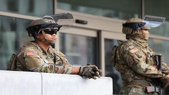 National Guard members keep watch outside the Edward R. Roybal Federal Building, during a protest against federal immigration sweeps, in Los Angeles, California, US, on Thursday. Reuters