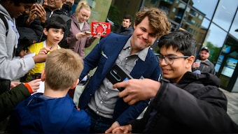 Magnus Carlsen obliges a selfie request from a young fan at the Norway Chess tournament in Stavanger, Norway. Image credit: Michal Walusza/Norway Chess