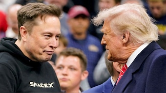 Elon Musk greets US President Donald Trump as they attend the NCAA men's wrestling championships in Philadelphia, Pennsylvania, US, March 22, 2025. File Image/Reuters