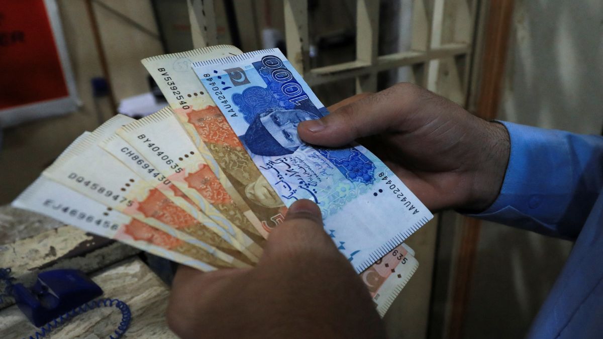 A man counts Pakistani rupee notes at a currency exchange shop in Peshawar, Pakistan, September 12, 2023. Representational Image/Reuters A man counts Pakistani rupee notes at a currency exchange shop in Peshawar, Pakistan, September 12, 2023. Representational Image/Reuters